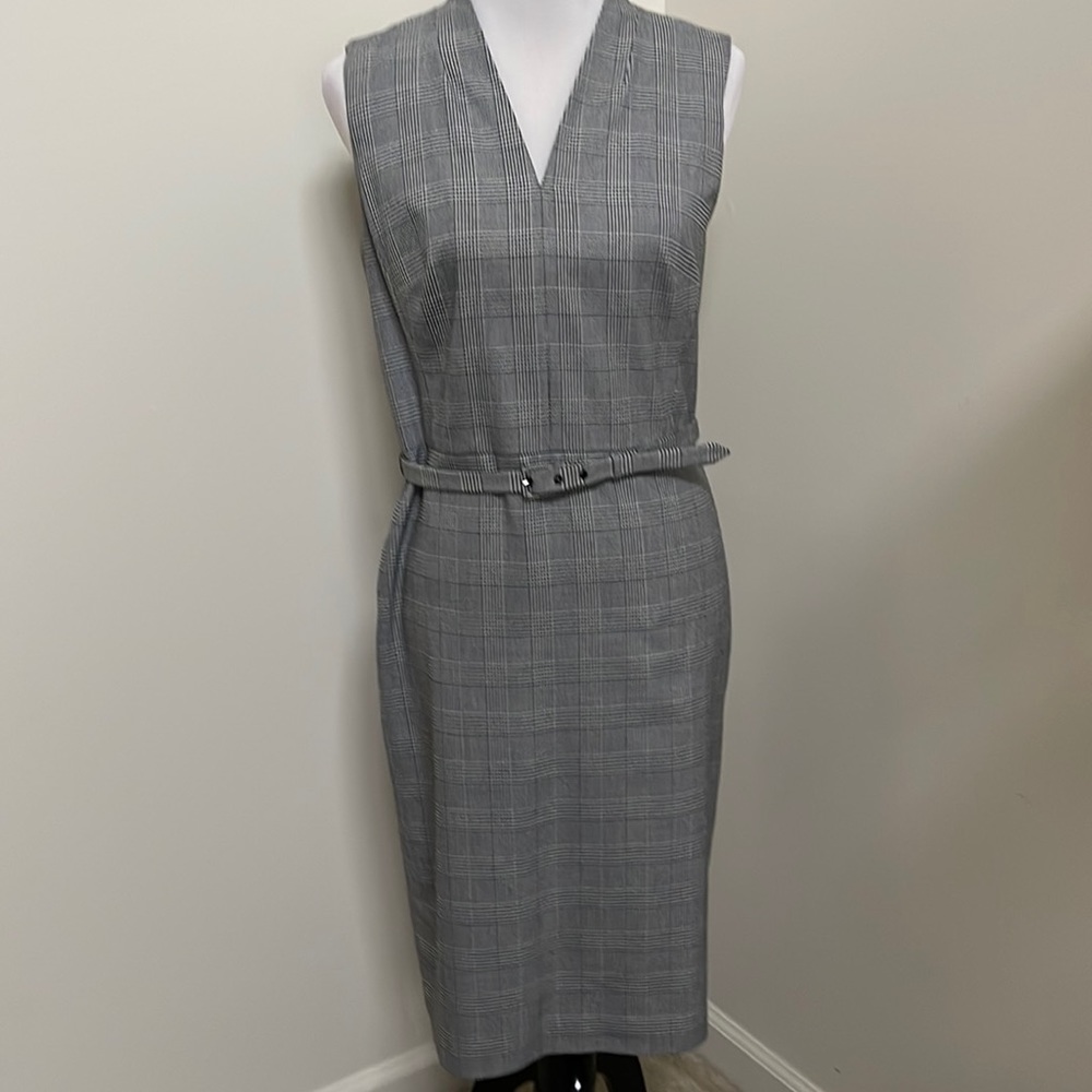 Black and white plaid belted dress.  Good condition. Belt loop pulled.